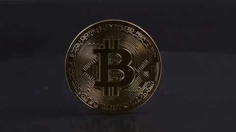 Bitcoin on a black background movement from left to right. Stock Footage 237859734