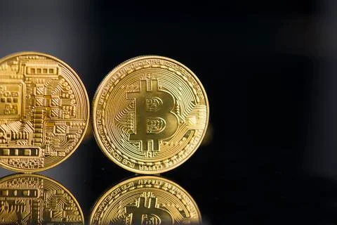 Bitcoin with black background Stock Photos