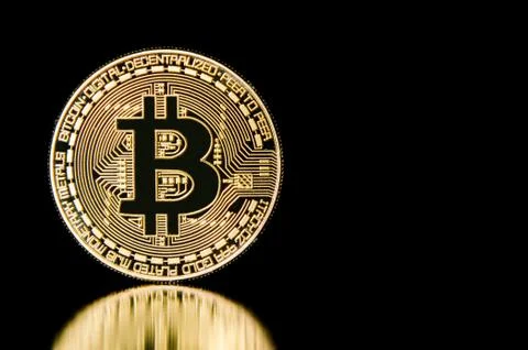 Bitcoin on black background with reflection Fotos de archivo