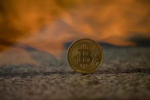 Bitcoin blown with fire Stock Photos