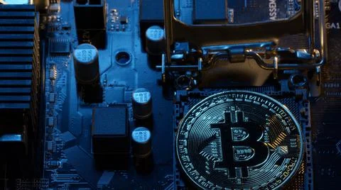 Bitcoin BTC coins in CPU central processor socket on digital pc motherboard 写真素材