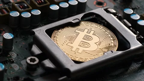 Bitcoin BTC on CPU socket of modern pc motherboard. Stock Footage 161156028