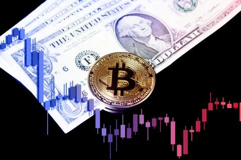 Bitcoin BTC cryptocurrencies on dollars with falling crashing graph in Stock Photos