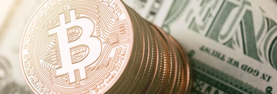 Bitcoin (BTC) cryptocurrency on dollar notes, digital money Stock Photos