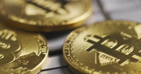 Bitcoin BTC cryptocurrency. Golden coins on laptop keyboard, macro shot with Vídeos de archivo 149273629