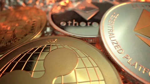 Bitcoin BTC, Etherium ETH Ripple XRP and another crypto currency in gold Stock-Footage 129802492