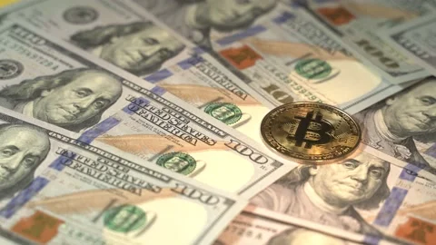 Bitcoin BTC lies on dollars bills. Time is money concept. Currency or cash Stock Footage 151470124