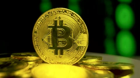 Bitcoin BTC spinning with moving binary code blockchain background Stock Footage 170516757