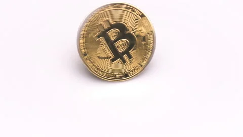 Bitcoin BTC spinning rotating isolated on white background close up. Macro shot Stock Footage 148810365