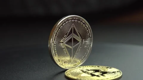 Bitcoin BTC spins on a black background, digital coin cyberspace cryptocurrency Stock Footage 171566979