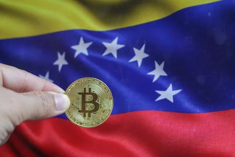 Bitcoin BTC on stack of cryptocurrencies with Venezuela flag in background... Stock Photos