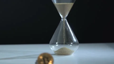 Bitcoin BTC with watch lies on table. Time is money concept. Currency or cash Stock Footage 162367451