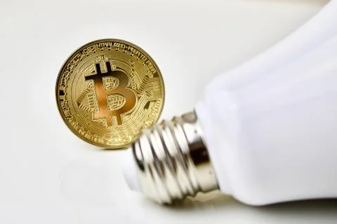 Bitcoin with a bulb Stock Photos