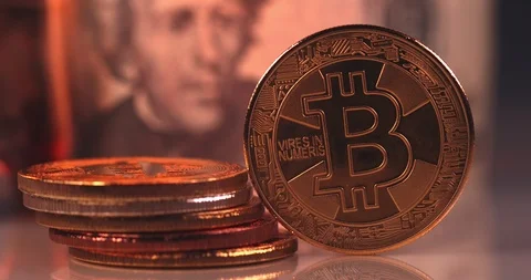 Bitcoin with burning cash on the background Stock Footage 114642308
