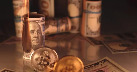 Bitcoin with burning cash on the background Stock Footage 114642353