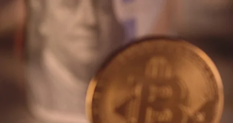 Bitcoin with burning cash on the background Stock Footage 114642376
