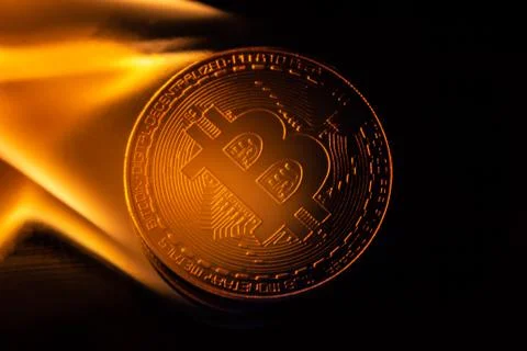 Bitcoin burning in fire on black background Foto stock