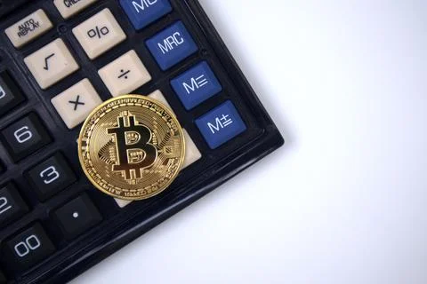 Bitcoin on calculator Stock Photos
