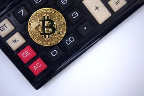 Bitcoin on calculator Stock Photos