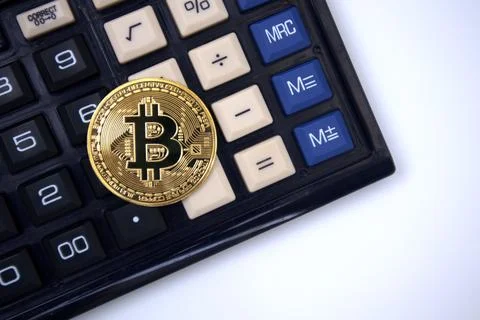 Bitcoin on calculator Stock Photos
