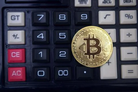 Bitcoin on calculator Stock Photos
