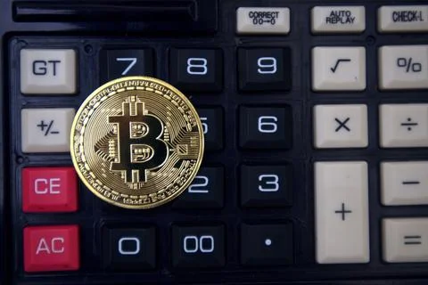 Bitcoin on calculator Stock Photos