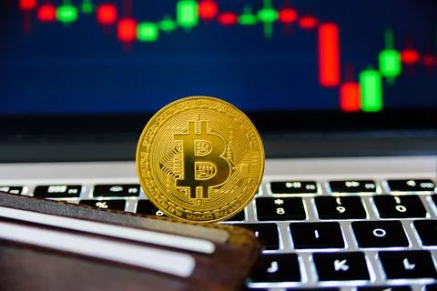 Bitcoin with chart on background Stock Photos