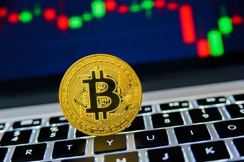 Bitcoin with chart on background Stock Photos