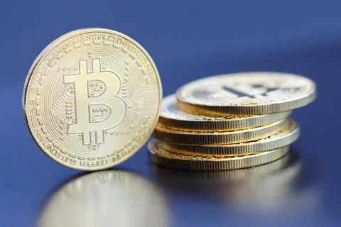 Bitcoin close-up on a blue background. 写真素材
