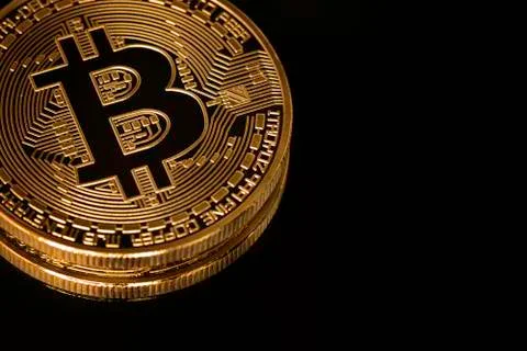 Bitcoin close up isolated on black background. Stock Photos