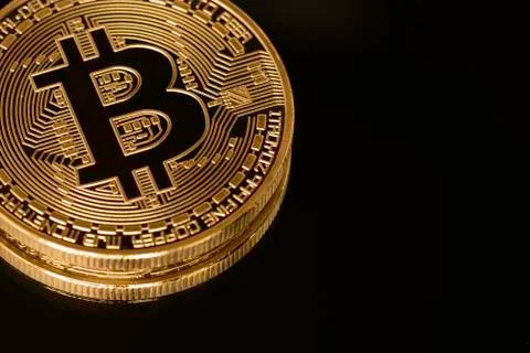 Bitcoin close up isolated on black background. Stock Photos