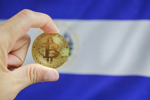Bitcoin close-up on the keyboard background, the El Salvador flag is shown .. Stock Photos