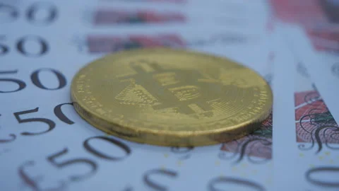 Bitcoin coin on the £50 bank notes. Stock Footage 236731607