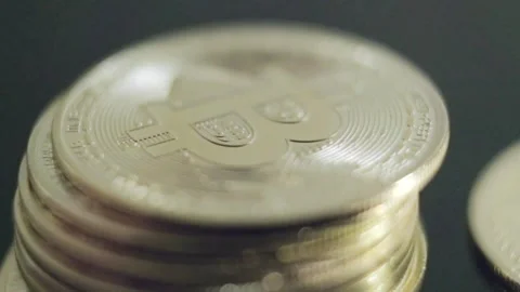 Bitcoin coin B Logo shining, Piling counting a bunch of golden money close up Stock Footage 274335100