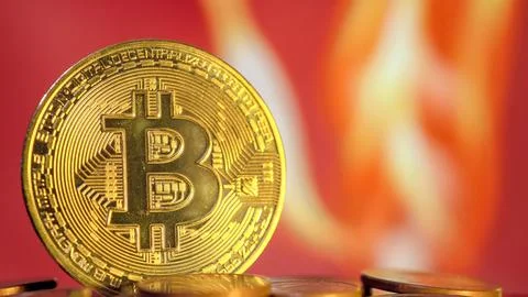 Bitcoin coin on background of red fire 写真素材