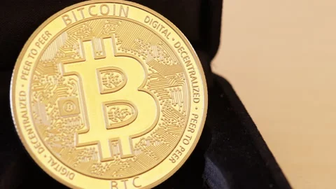 Bitcoin coin from blurred to close up Stock Footage 130828426
