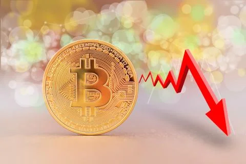 Bitcoin coin with a decreasing trend graph Stock-Fotos