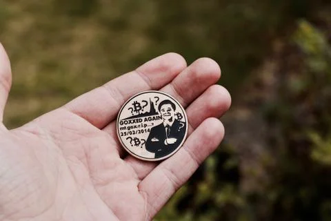 Bitcoin coin in hand Stock Photos