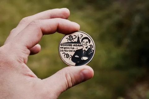 Bitcoin coin in hand Stock Photos