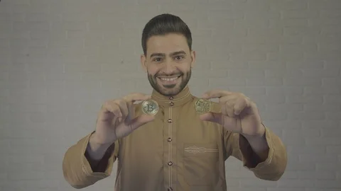 Bitcoin coin in the hands of an man. Camera in 4 K. Stock Footage 87834152