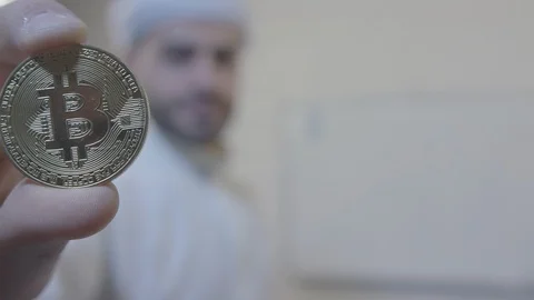 Bitcoin coin in the hands of an man. Camera in 4 K. Stock Footage 87835760