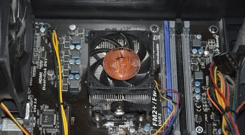 Bitcoin coin inside the computer system unit. blockchain Stock Photos