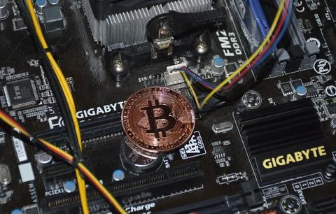 Bitcoin coin inside the computer system unit. blockchain Stock Photos