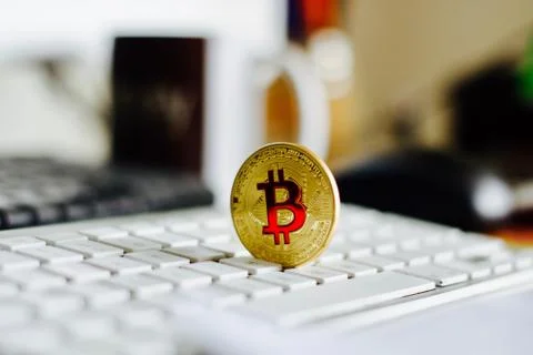 Bitcoin coin on the keyboard Stock Photos