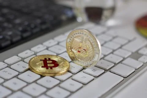 Bitcoin coin on the keyboard Stock Photos