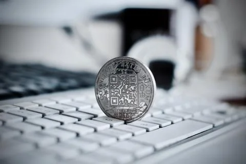Bitcoin coin on the keyboard Stock Photos