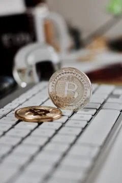 Bitcoin coin on the keyboard Stock Photos