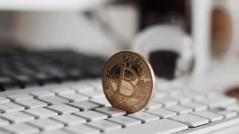 Bitcoin coin on the keyboard Stock Photos