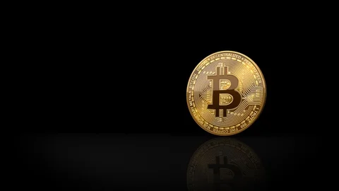 Bitcoin coin rolling into scene on black background 库存影片 91919082