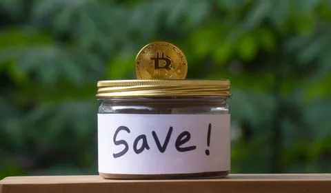 Bitcoin Coin on Saving Jar for Crypto Investment Concept Stock Photos